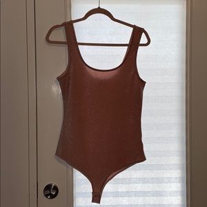 Sparkly pink bodysuit